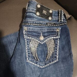 Miss Me Dark Blue Jeans with Silver Wings On Back Pockets.